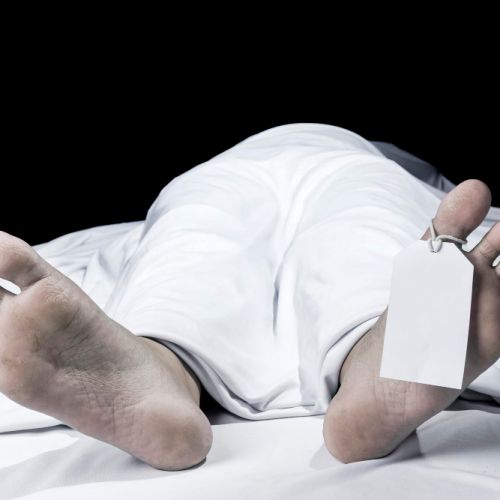 human-corpse-covered-with-sheet-name-tag-toe-morgue.jpg