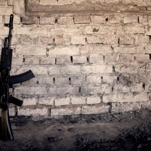 submachine-gun-kalashnikov-ak-47-against-wall.jpg